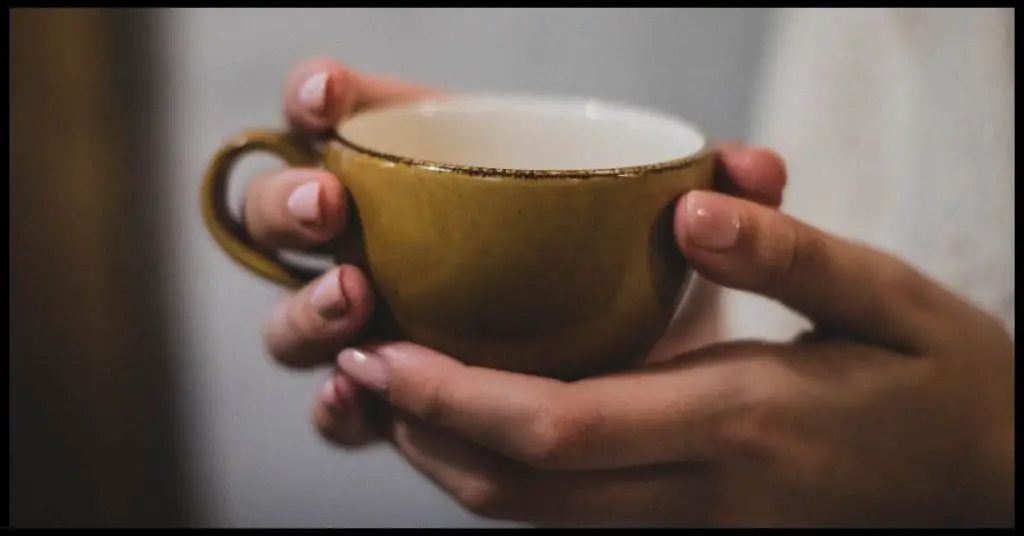 Tea cup in hand